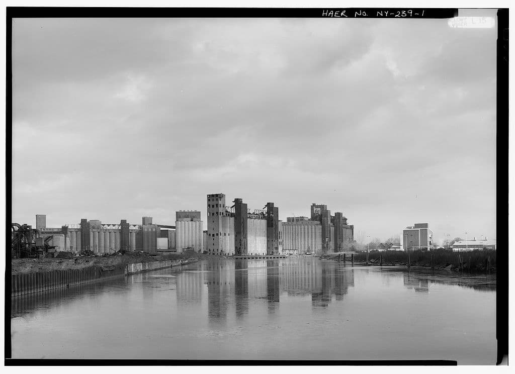 Black-and-white general view of historic grain elevators along the Buffalo River