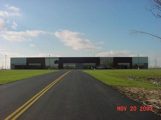 Distribution building and landscaped grounds constructed over part of the capped Forest Glen Superfund site