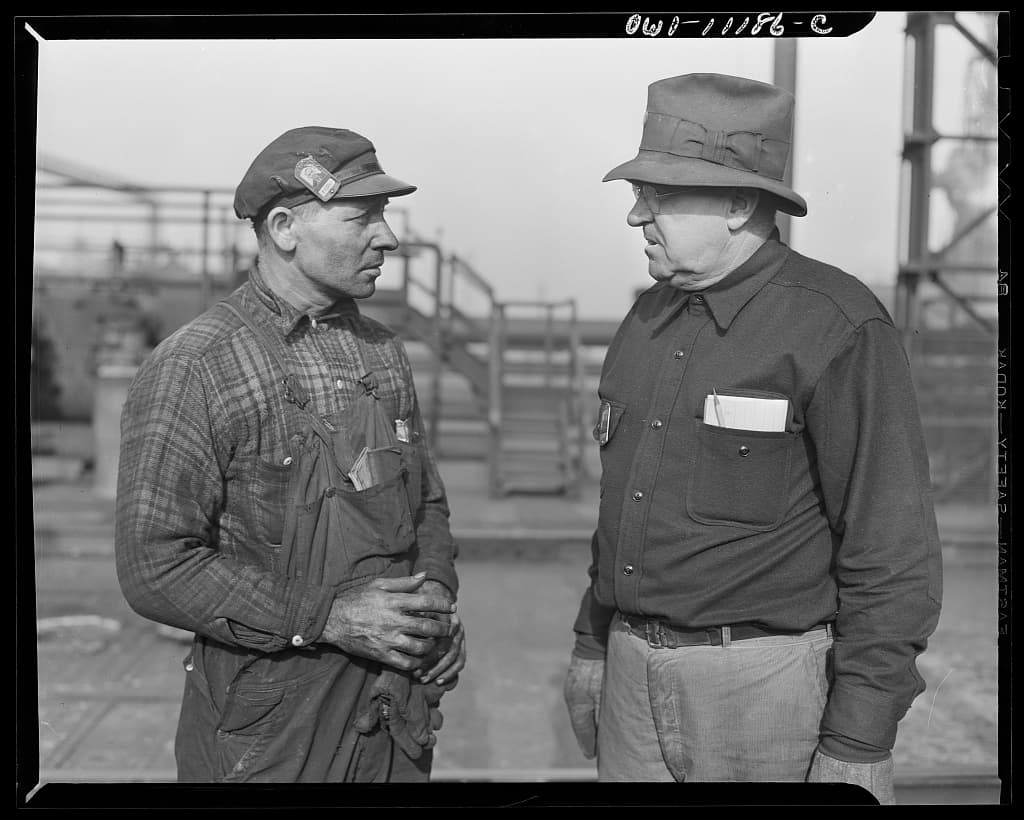 Two workers supervising coke ovens at a Hanna furnace operation in Detroit during 1942